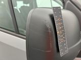 a car mirror with a measuring tape on the side of it