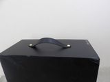 a black box that has a handle on it