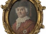 une vieille photo d'un homme vêtu d'un manteau rouge et d'un chapeau