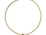 un collier en or jaune serti d'émeraudes et de diamants