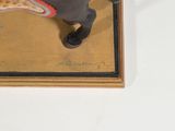 painting of a horse and rider on display in a gold frame