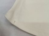 a white t - shirt with a black stripe on it