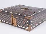 an old wooden box with a decorative design on it