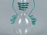 an image of a glass vase with a green handle
