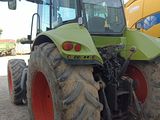 a tractor that is parked in the dirt