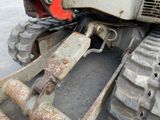 a close up of a tractor tire with a chain attached to it