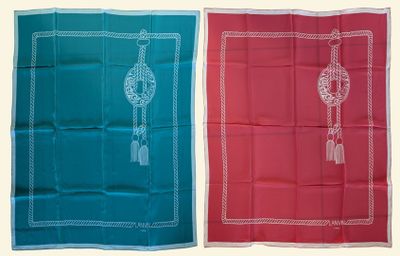 two different colored bandas with tassels on them