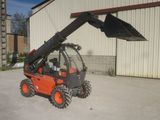 a picture of a small orange ski - doodle parked in front of a building