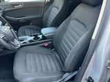 the interior of a car with the front seats folded down