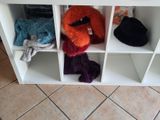 many stuffed animals sitting on the shelves in the room