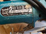 a close up of a blue machine with a number on it