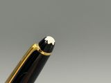 a close up of a pen with a white flower on it
