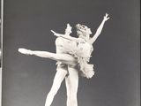 black and white photograph of two ballerinas performing on stage