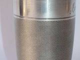 a silver cup that is sitting on a table