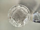 a glass object on the table next to a toothbrush