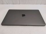an apple macbook air laptop computer sitting on top of a table