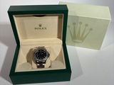 a box with a watch inside of it on a table