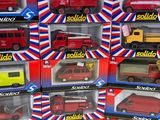 six red and yellow toy trucks in the boxes