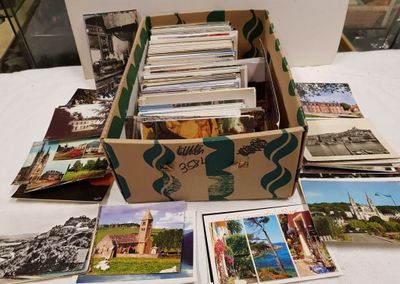 a box full of postcards sitting on a table