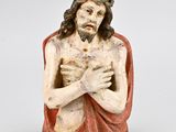 an image of a statue of jesus holding his hands together