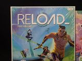 two games on the table, one is reloaded and the other is reloaded