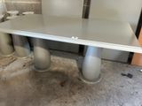 a table that has two chairs around it