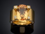 an image of a yellow gold ring with a large citrine stone and diamonds