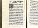 an open book with a picture of a man on it