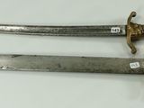 pair of old swords on a white surface with a white background
