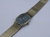 an image of a close up of a wrist watch on a white surface