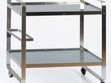 stainless steel and glass serving cart on casteors on a white background