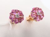 a pair of pink sapphire and diamond stud earrings