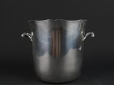 silver ice bucket with handles on a black background