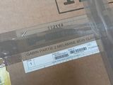a pair of scissors sitting on top of a cardboard box