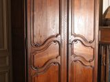 an image of a large wooden cabinet in a room