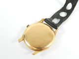 an image of a close up of a wrist watch on a white surface