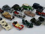 a lot of toy cars that are sitting on a table