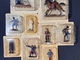 a lot of figurines of soldiers in plastic containers