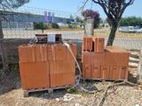 a pile of bricks sitting on a pallet next to a tree