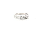 a close up of a diamond ring on a white background