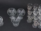 a lot of empty glasses on a black table