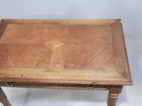 a small wooden table with a drawer on top of it