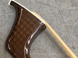 a wooden handle with a wooden stick sticking out of it