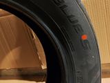 tire tread of a motorcycle on a cardboard box in a room