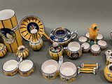 many different types of vases and bowls on the table
