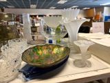 a glass bowl sitting on top of a table in a store