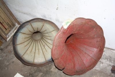 a red and white object on the floor next to a brown object