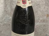 a bottle of wine that is sitting on a table