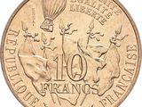 an image of a 10 franc coin with a hot air balloon in the background