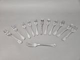 a lot of forks and spoons arranged in a circle